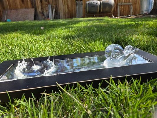 Metal and resin snail mirror.