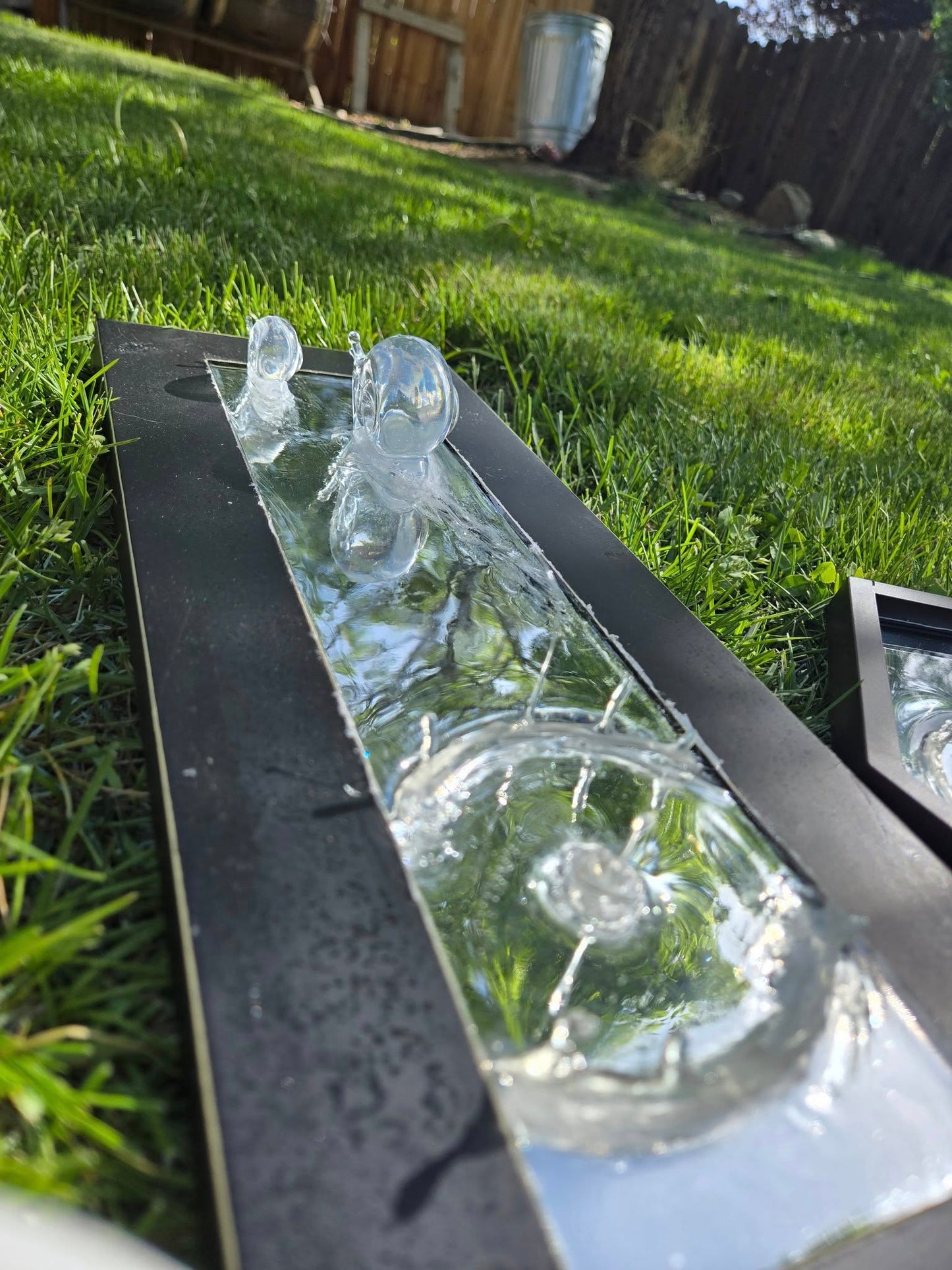 Metal and resin snail mirror.
